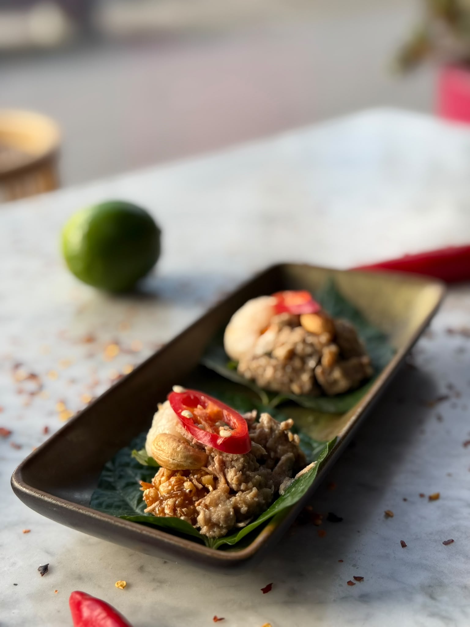 BangPop betel leaf bites with chilli, cashews and lime