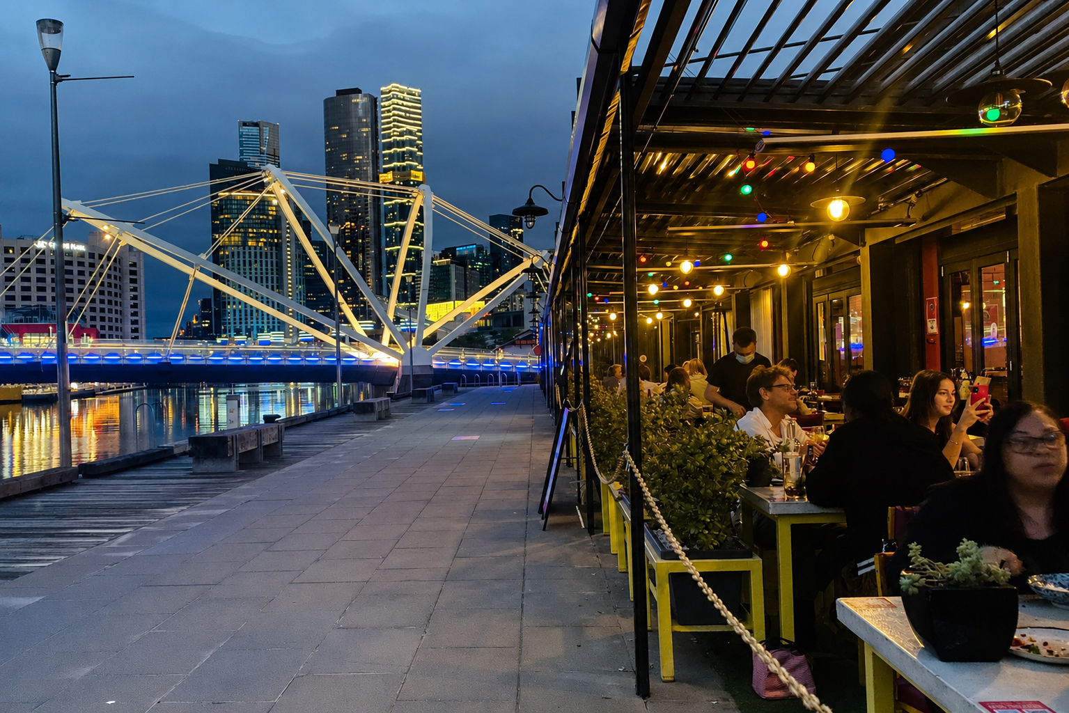 Guests dining on BangPop's Riverside Terrace beside the Yarra River